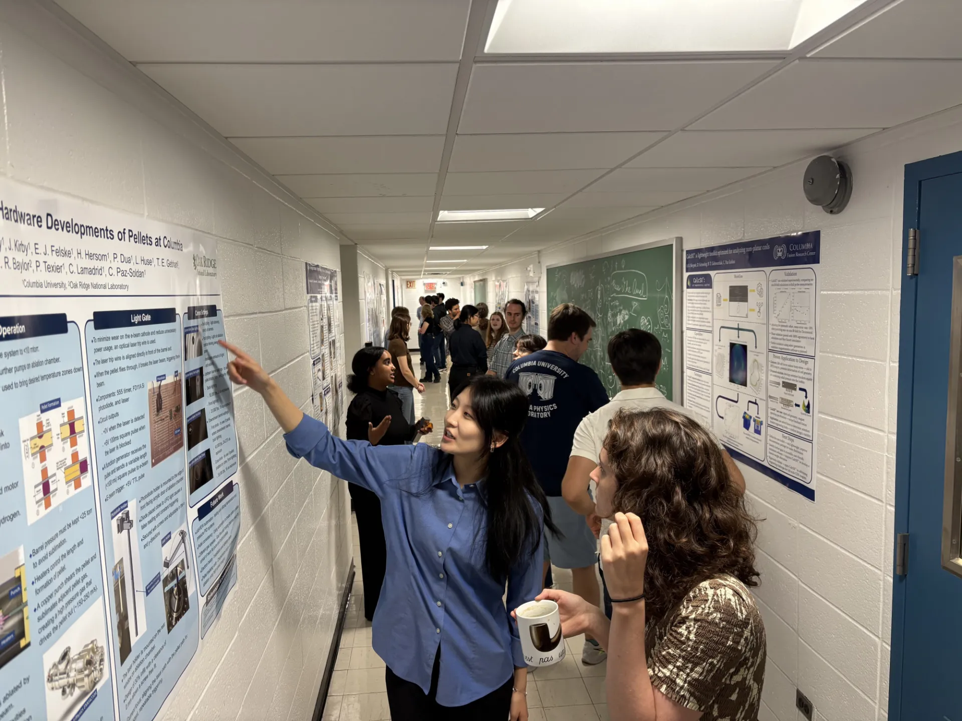 Graduate student Alexa Lachmann (right) observes the research presentation delivered by undergraduate student Brianna Lan (left)