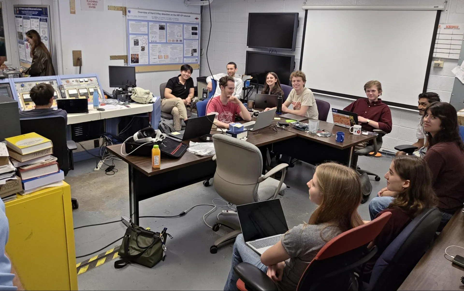 Students gather in the control room to operate the HBT-EP tokamak during the Fun Run, discussing plasma physics concepts and tokamak operation techniques with Dr. Jeff Levesque and the primary operator team.
