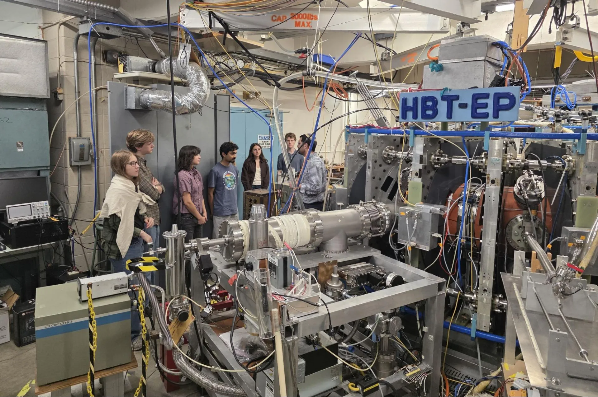 Noah Notis (Columbia) instructs participants about critical operating systems around the tokamak.