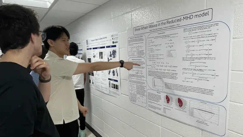 Henri Yoon presenting his poster to judges