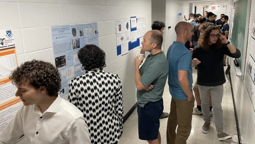 Anonymous judges visited the posters and spoke with the students.
