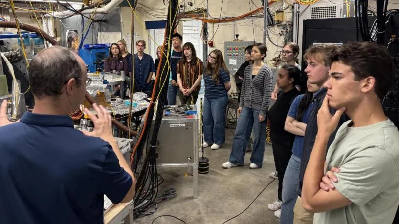 Students taking a tour of the facilities at the lab