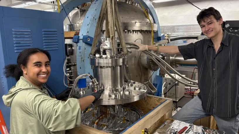 Two students testing magnets at the Columbia Stellarator Experiment