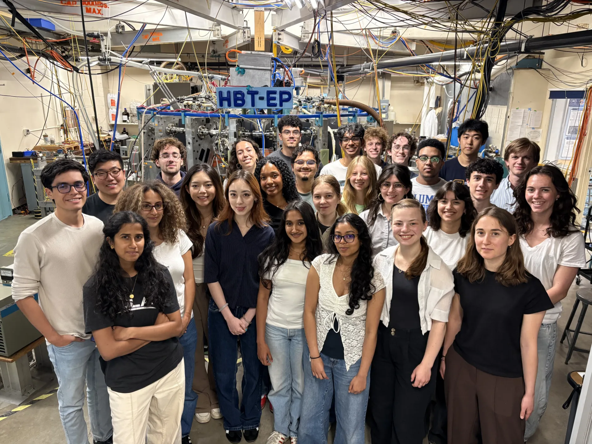 Summer interns at the Columbia Fusion Research Center in front of the HBT-EP Tokamak Device