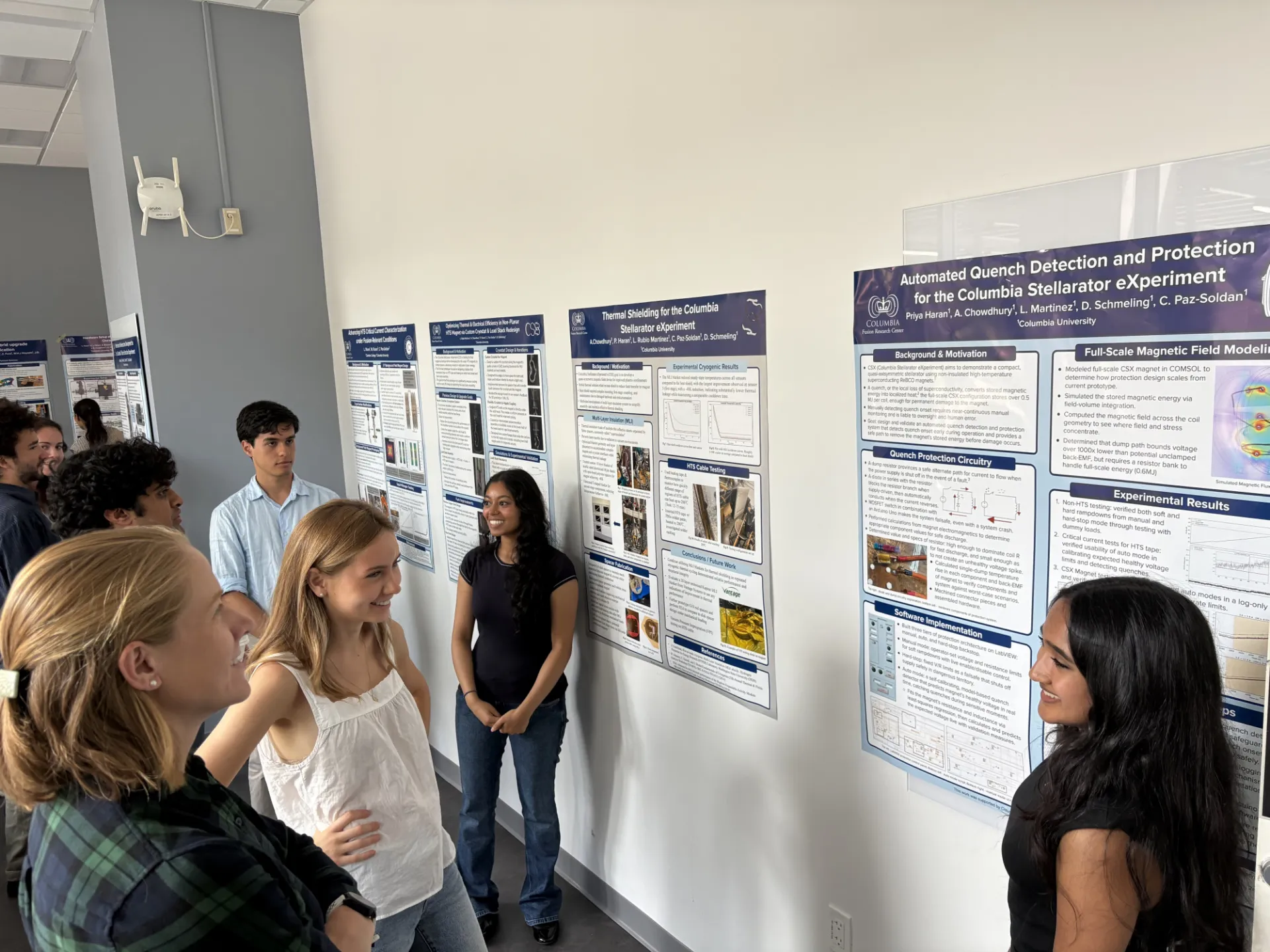 Students presenting posters in Summer Poster Symposium